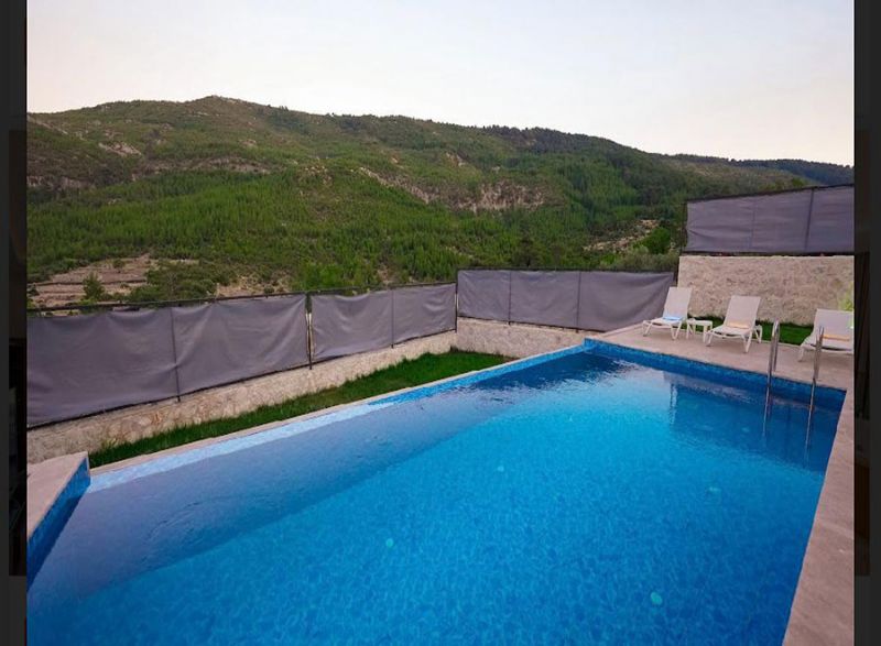 Four fully furnished detached villas for sale.