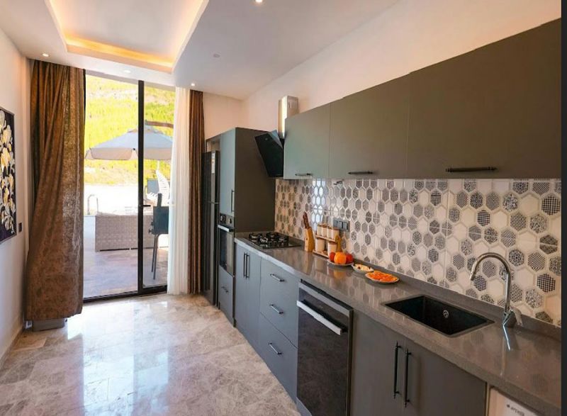 Four fully furnished detached villas for sale.